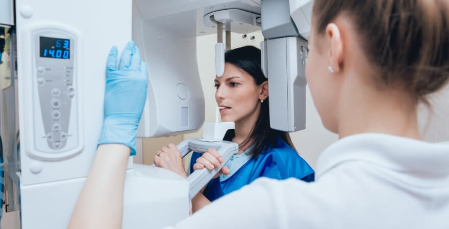 Woman receiving scan of her mouth and jaw with advanced dental technology