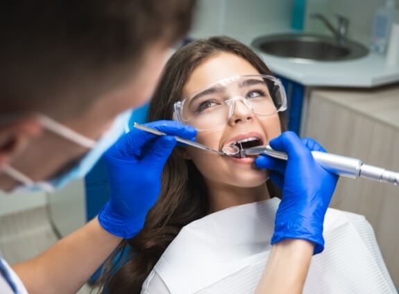 Young woman undergoing root canal treatment